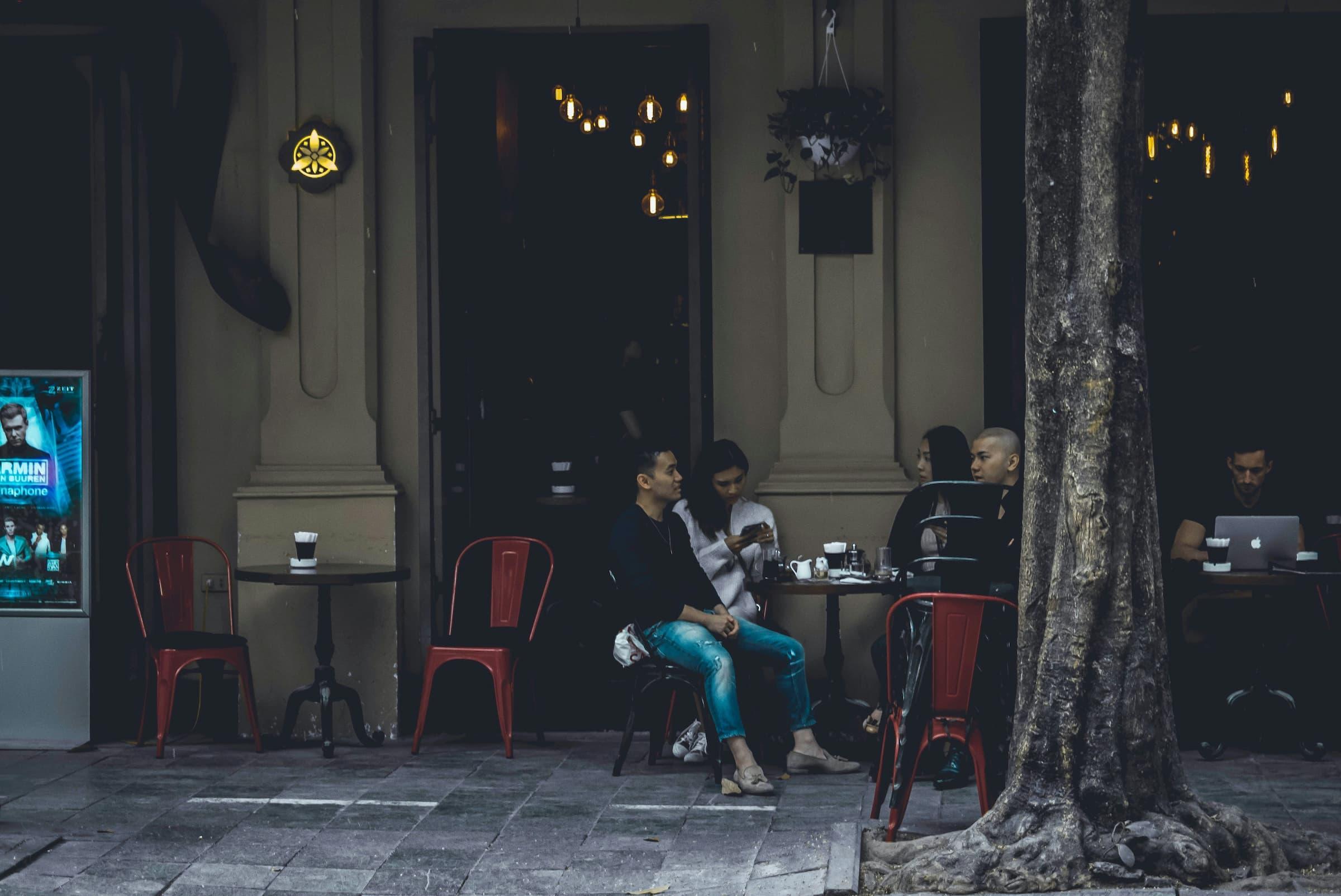 Customers sitting in front of the restaurant.